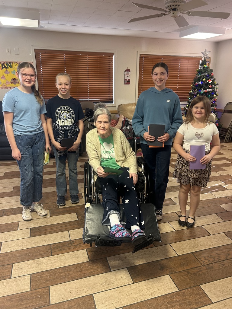 students giving christmas cards