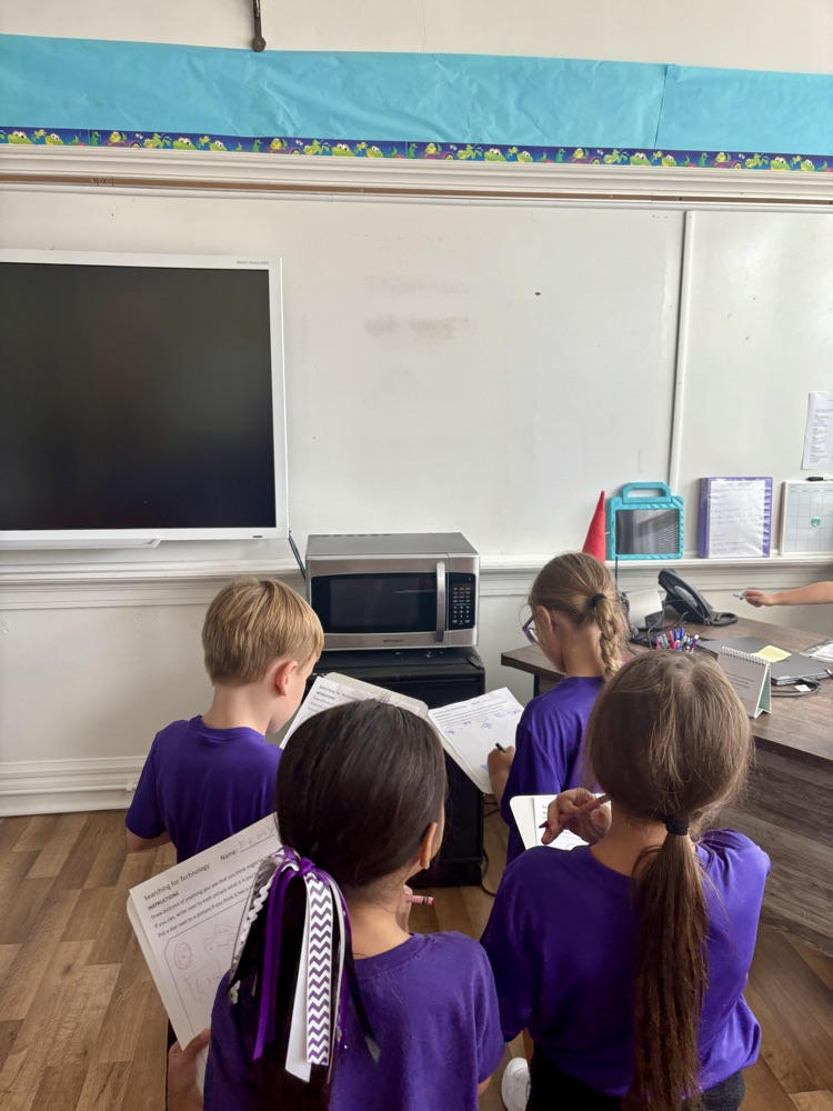Second grade finding different types of technology around the school!