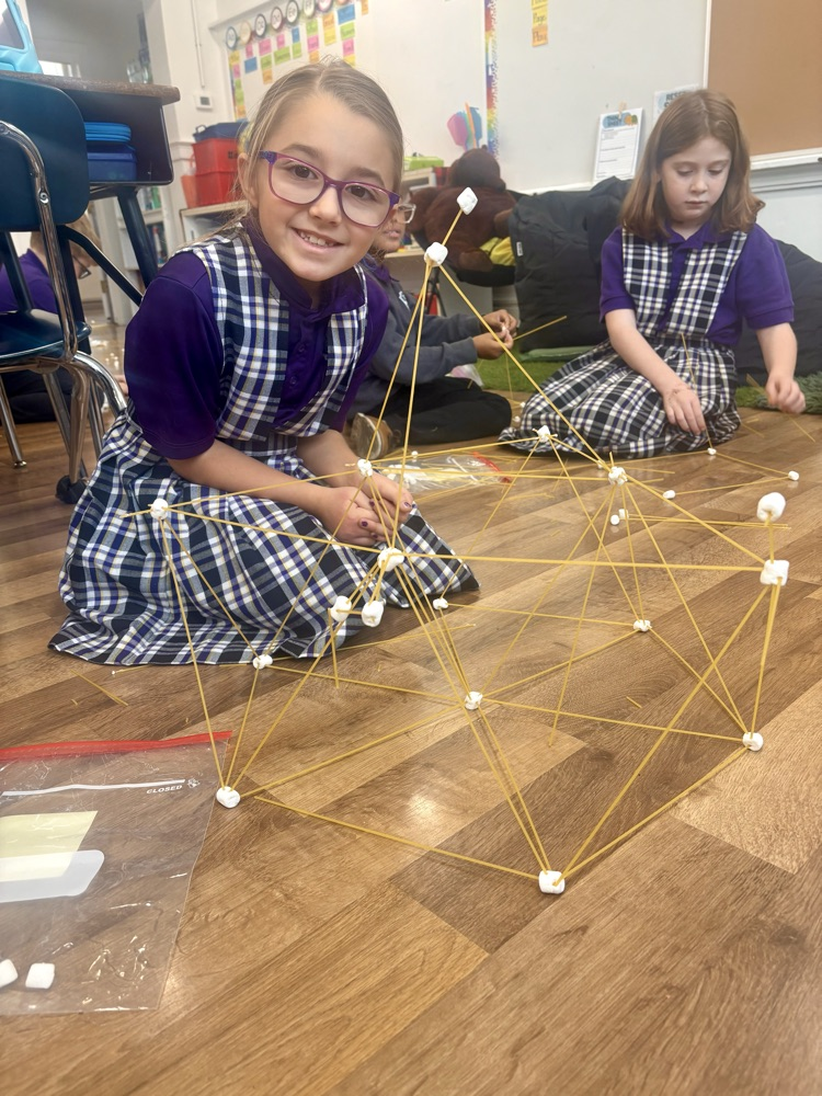 Norah Pagano building her spaghetti tower!
