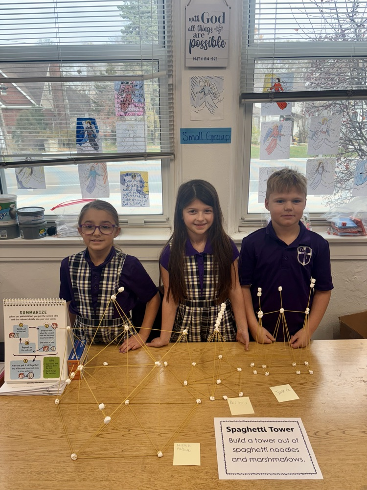 Norah, Paisley, and Jack comparing their towers.