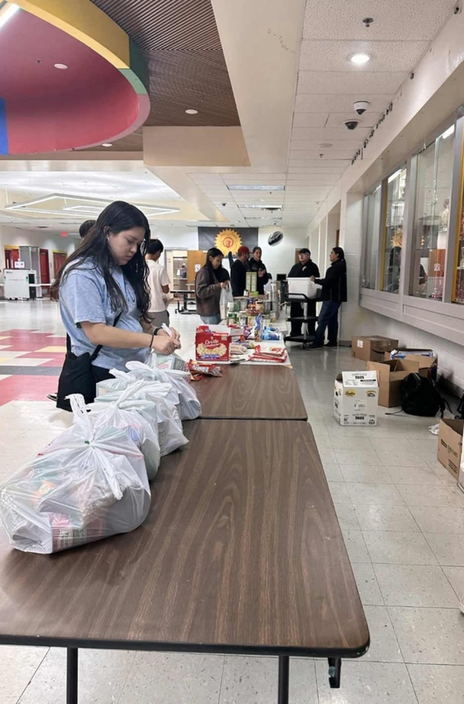 Student preparing food bag