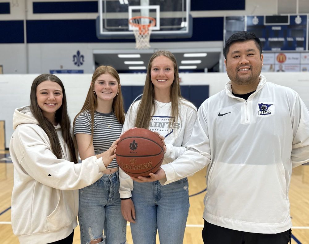 New Saints girls basketball coach & captains