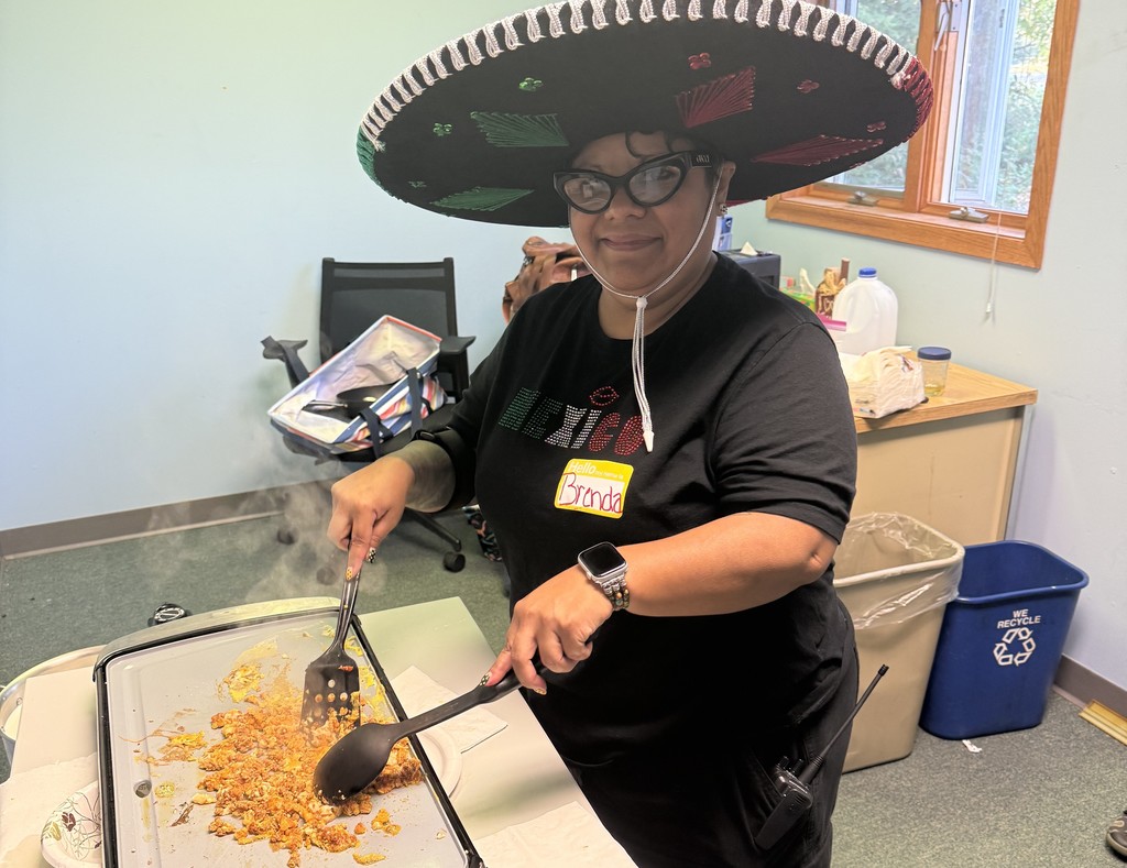 Making huevos con chorizo at OLA/Hoffmann Center