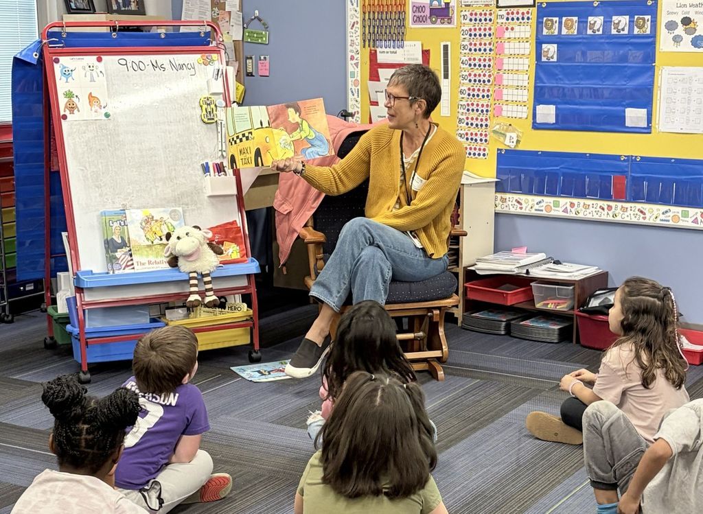 Mrs. Sizer reading to Mrs. Hartfiel's kindergarten class at South
