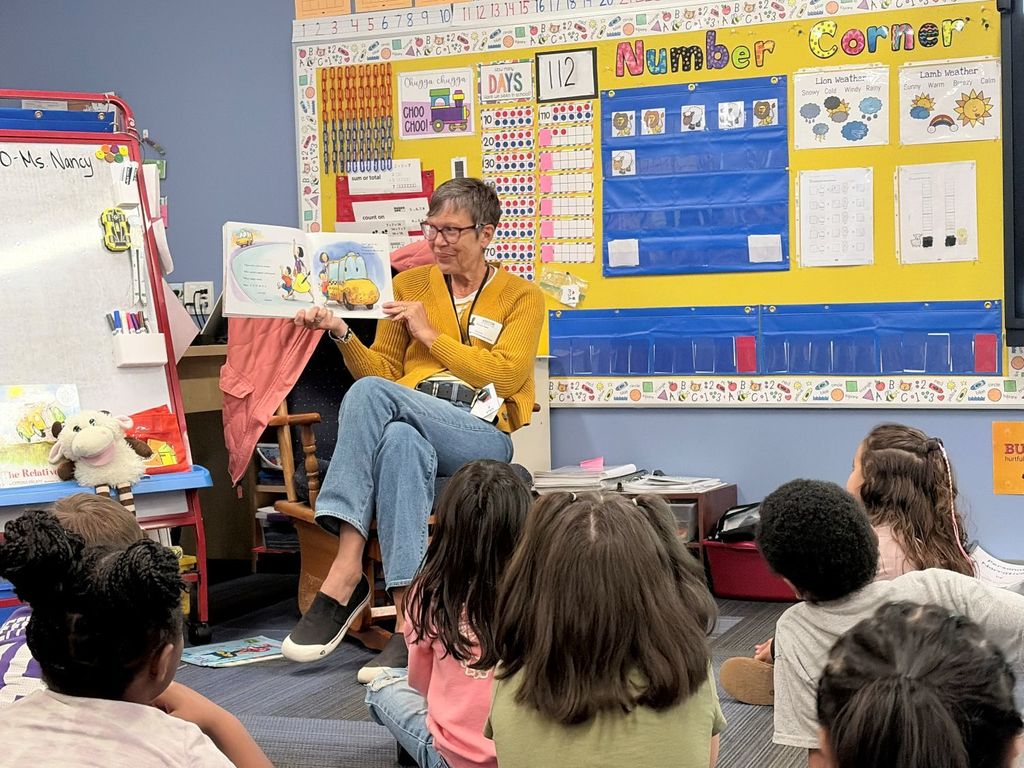Mrs. Sizer reading to Mrs. Hartfiel's kindergarten class at South