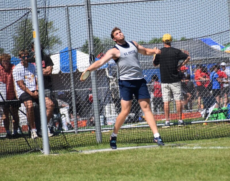 Parker Maloney throwing the discus at state meet.
