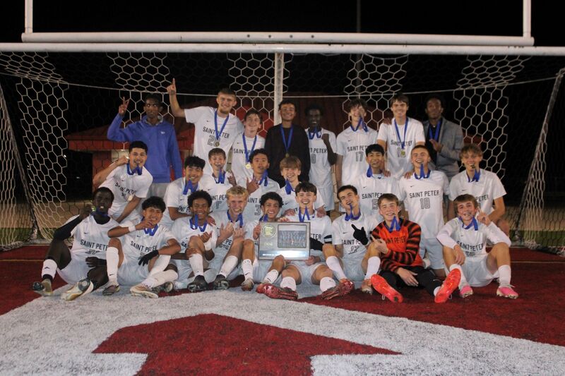 Saints boys soccer team celebrating Section 2A title