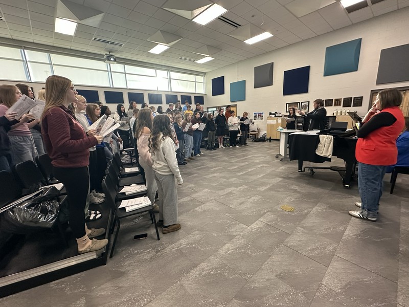 Dr. Robison working with SPHS choir students