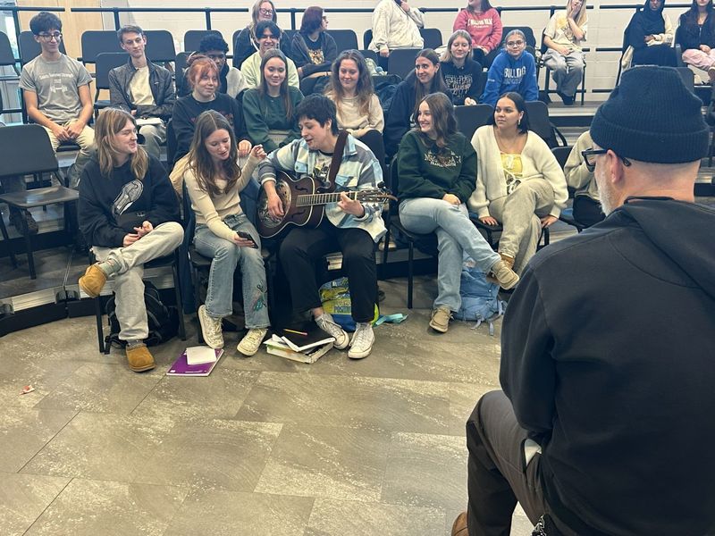 Nate Boots meeting with creative writing students