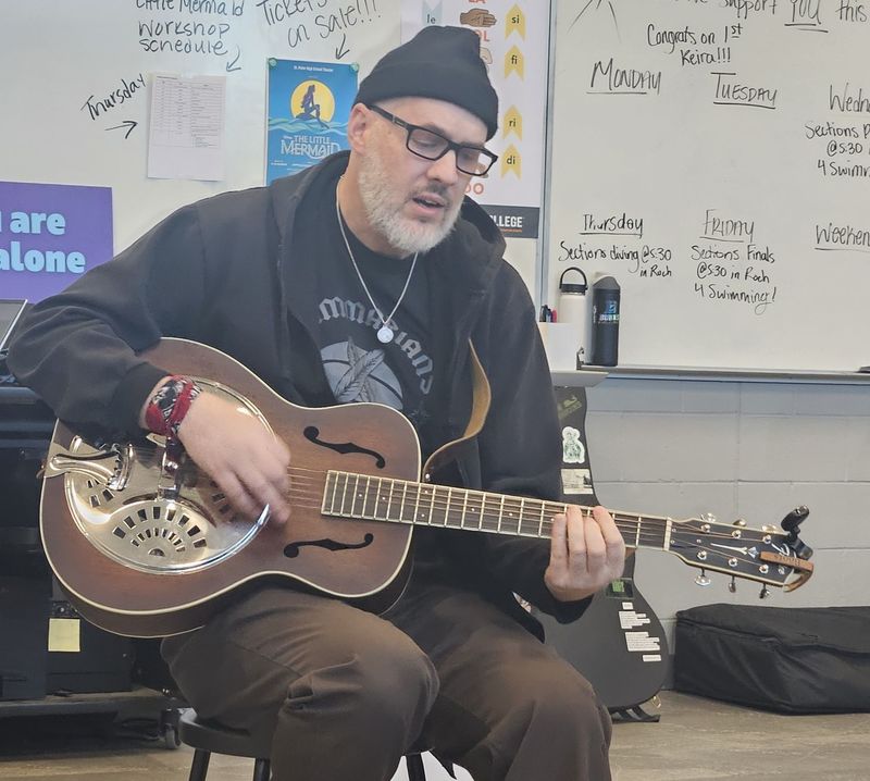 Nate Boots meeting with creative writing students
