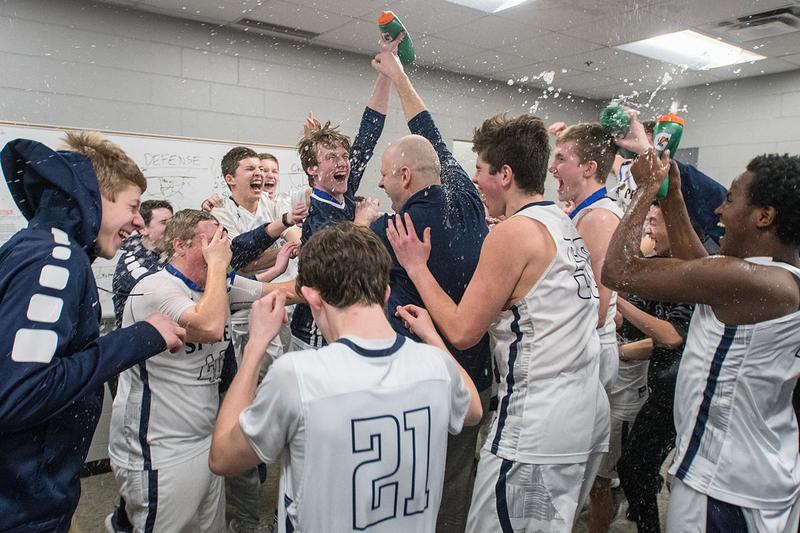 Saints coach Sean Keating celebrating with the 2019 team