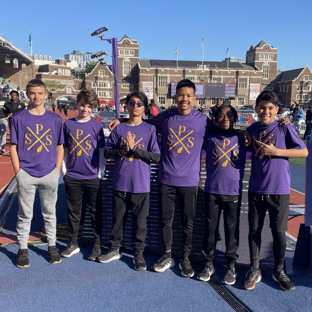 boys wearing purple track t-shirts at Penn Relays 2024