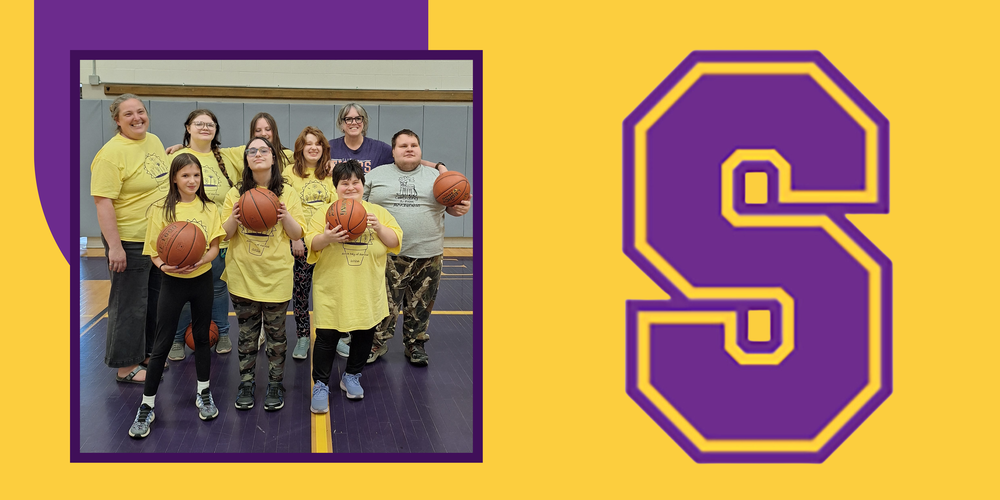 Photo of the unified basketball team smiling. They are holding basketballs and each wearing the team's light yellow tshirt uniform
