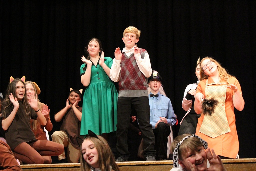 photos of students during 101 Dalmatians performance