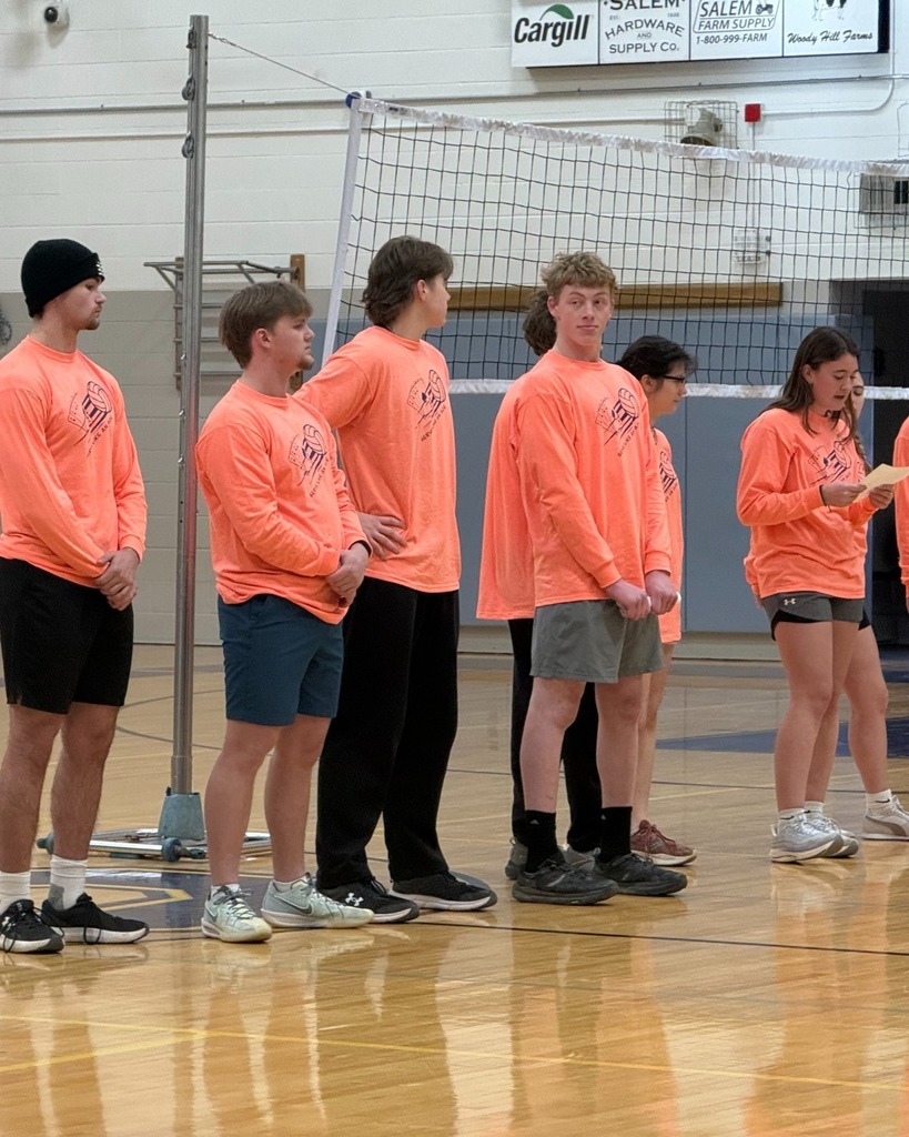 students standing on court during assembly