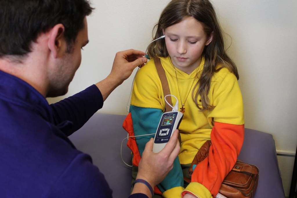 school nurse tests child's hearing
