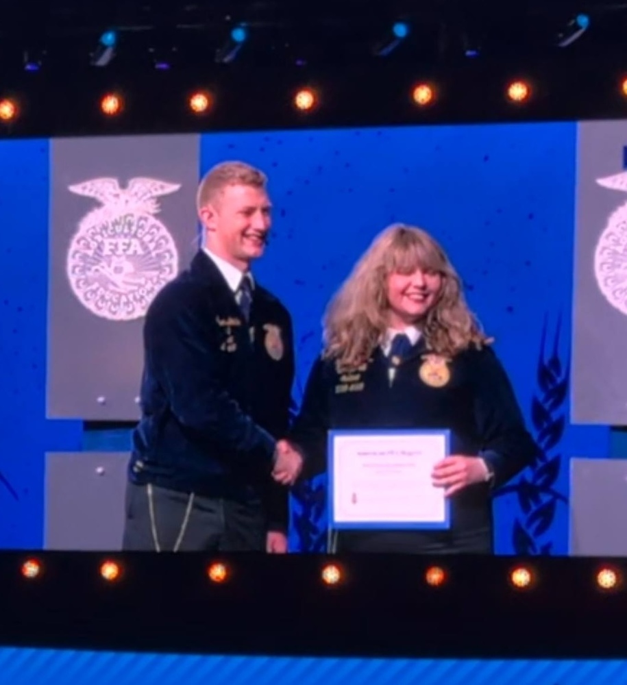 Katie Larrimore receiving award