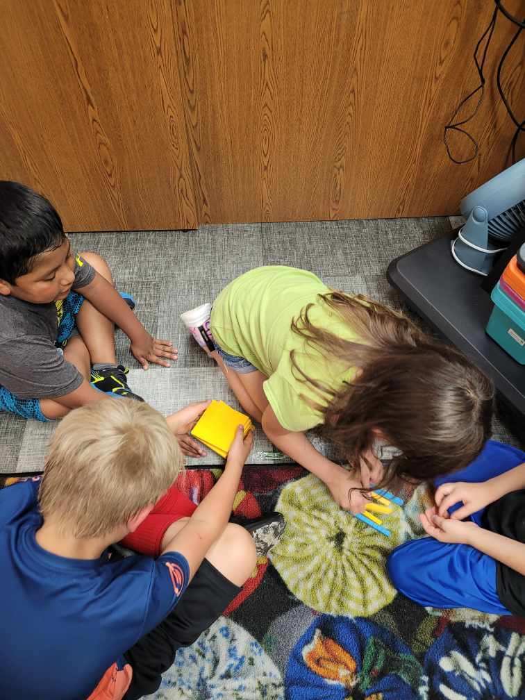 Students working with building blocks