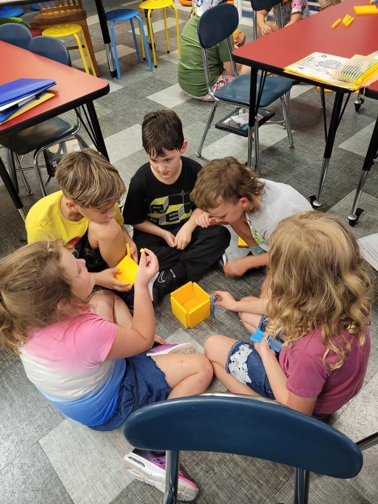 Students working with building blocks