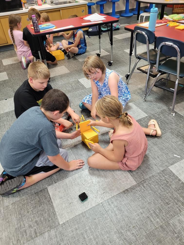 Students working with building blocks