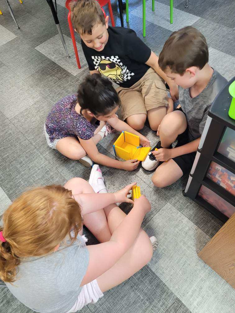 Students working with building blocks