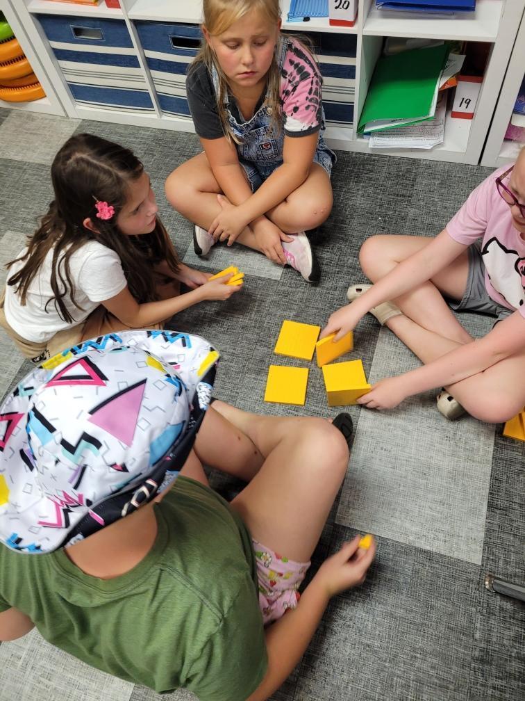 Students working with building blocks