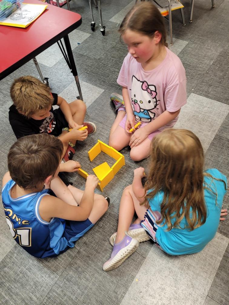 Students working with building blocks