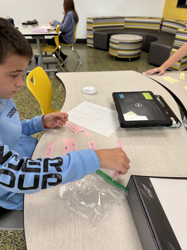 Sixth grade math students working in the steam lab