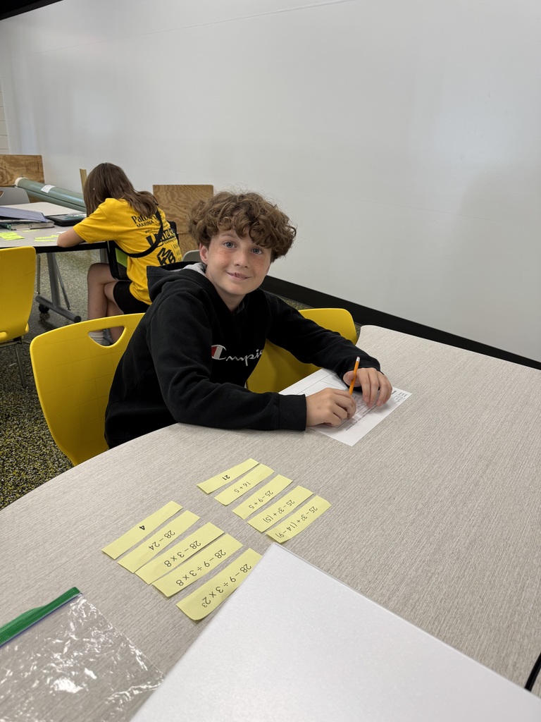 Sixth grade math students working in the steam lab