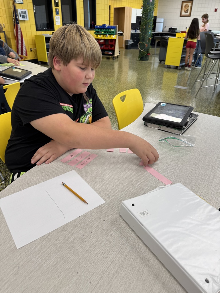 Sixth grade math students working in the steam lab
