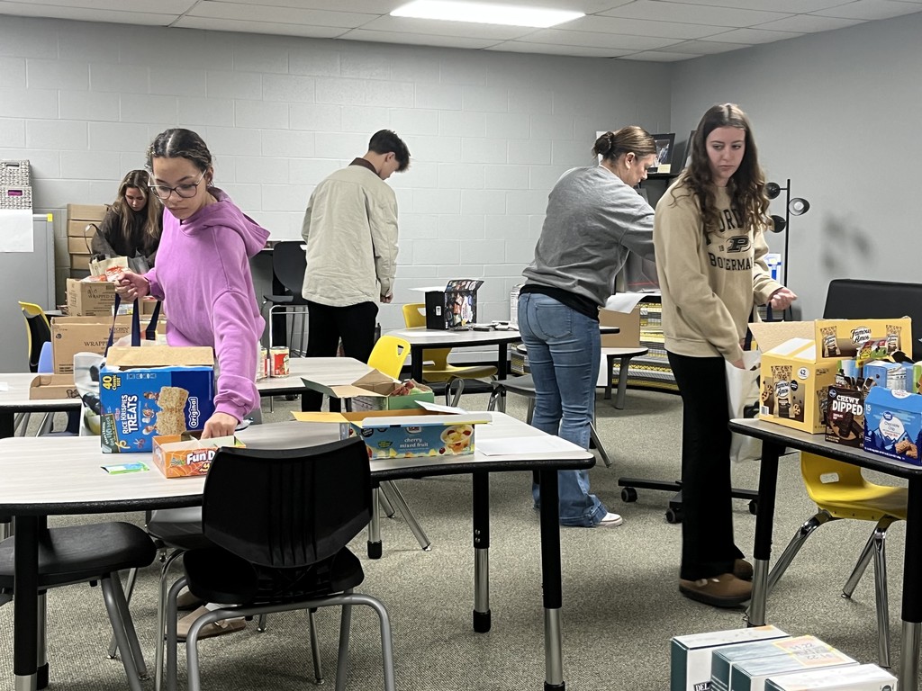 Student council members packing up food