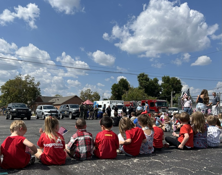 Emergency vehicles on display as students look on before the assembly began. 