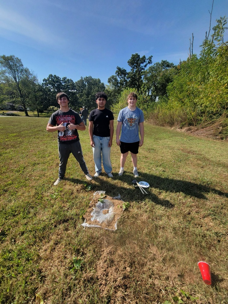 Ecology students making a water still
