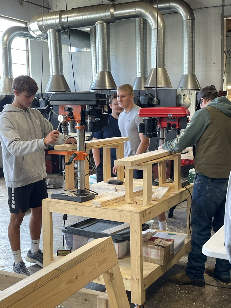 Students building beds