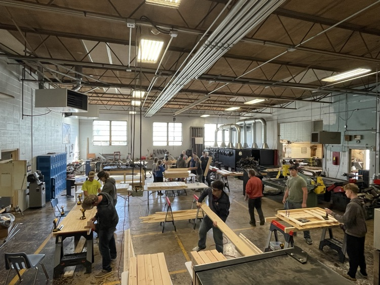 Students building beds