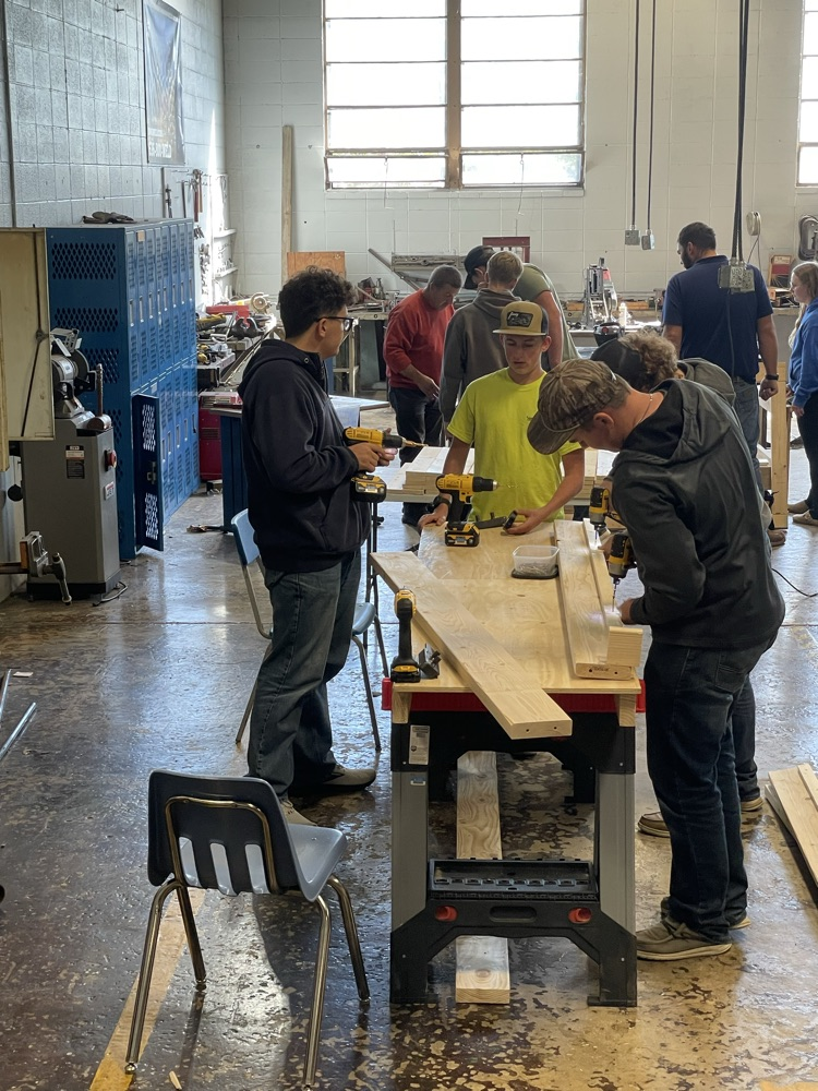 Students building beds