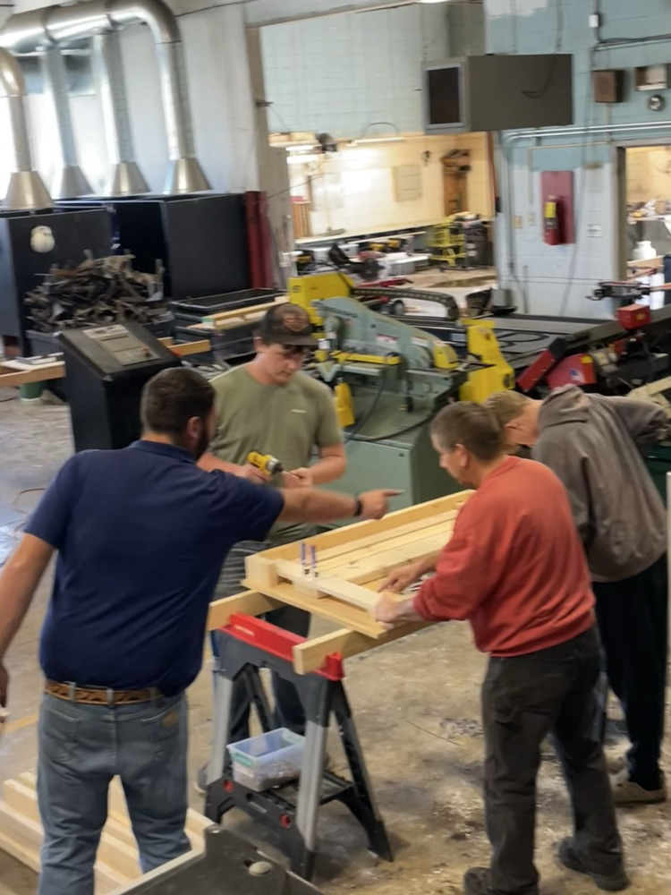 Students building beds