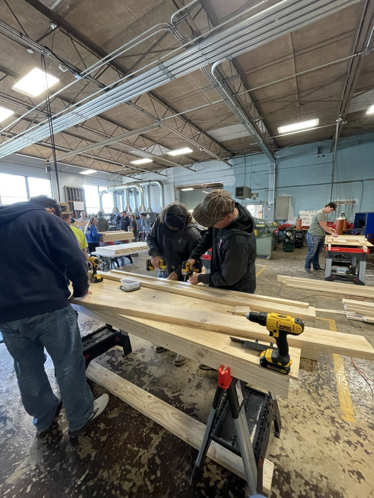 Students building beds