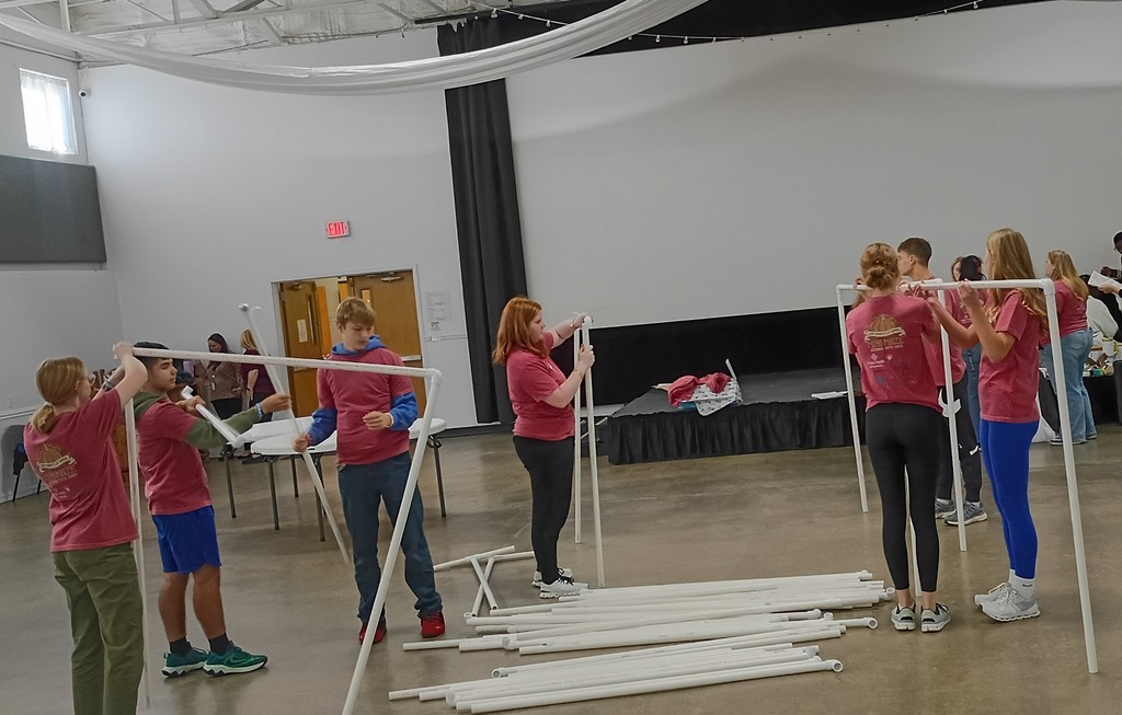 Students building partitions