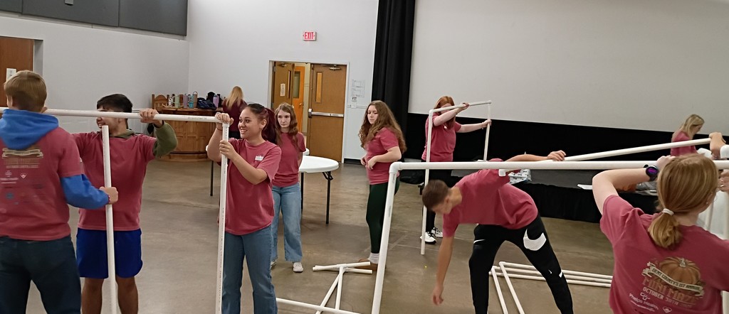 Students building partitions