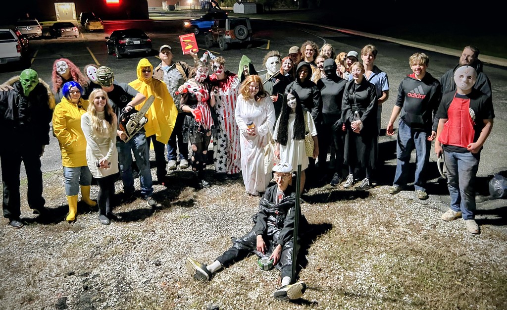 Group of students and teachers in Halloween costumes