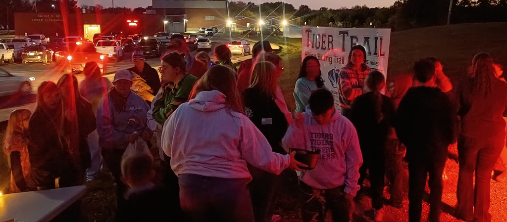 Group of people waiting to go into a haunted trail