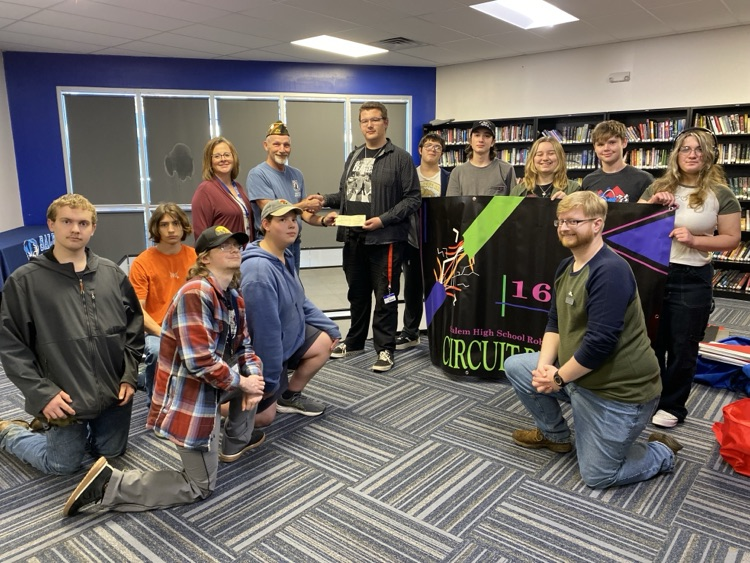 Robotics team presented with check