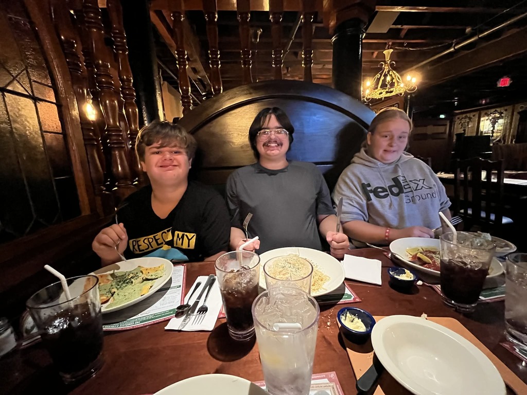 This is a picture of the students that went to the old Spaghetti Factory eating lunch.