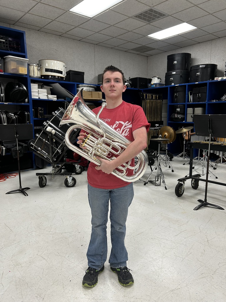 Mason Tomnitz holding his euphonium. 