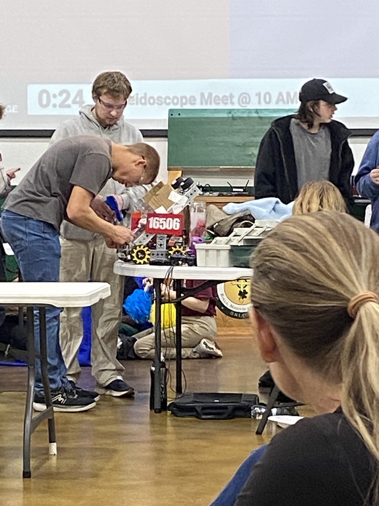 Nicholas Thies and Ian Owens make last minute adjustments before the next match.