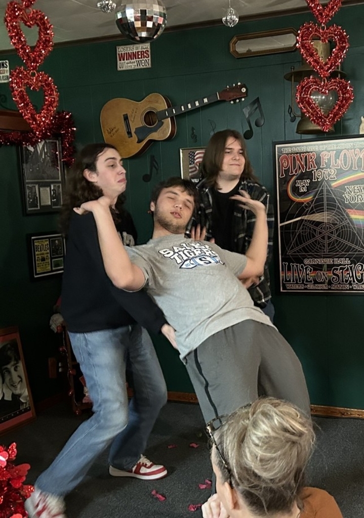 students performing a dance on stage