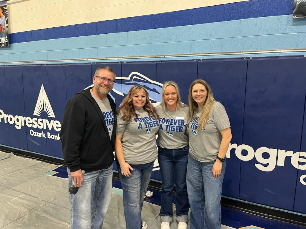 Asst. Principal, two counselors, and Principal posing for a picture. 