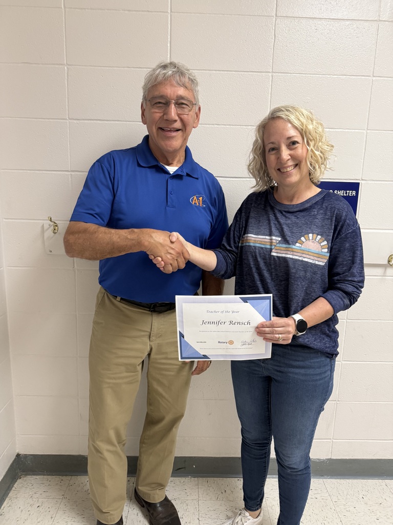 Jennifer Rensch recieves Teacher of the Year award from Jim Standfast.