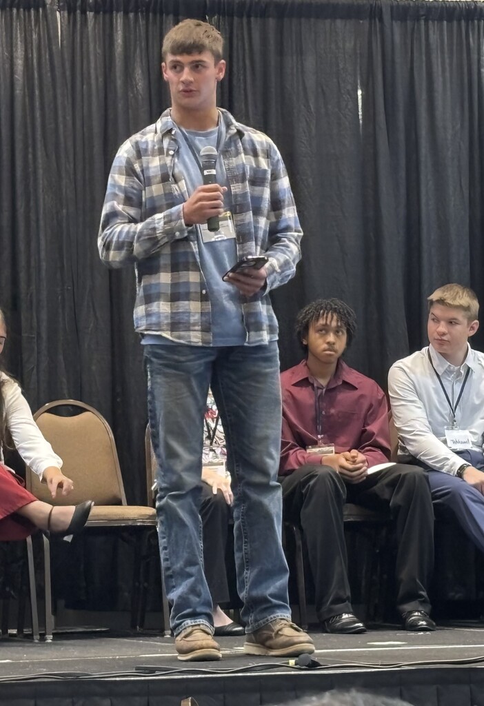 Sylis giving his speech on stage